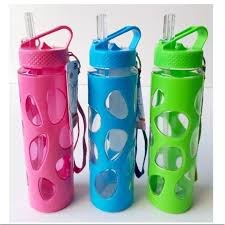 Three clear reusable water bottles with pink, blue, and green bubble cutout silicone sleeves, carrying loops, and pop-up straws standing on a white background.